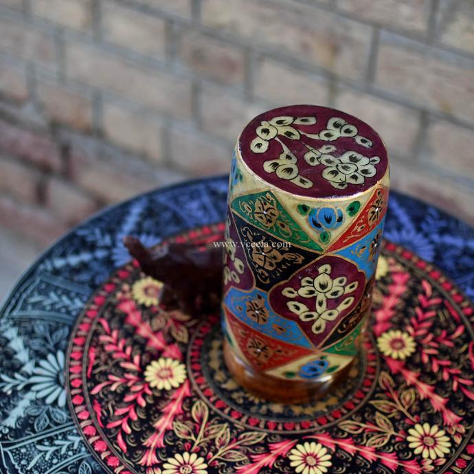 Camel skin lamps with intricate patterns and textures on a wooden table