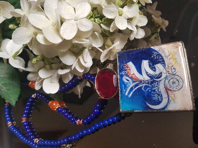 Calligraphic pendant