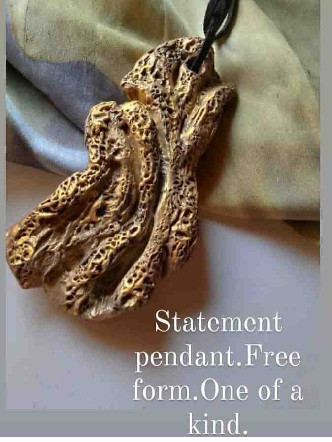 Hand sculpted pendant necklace.