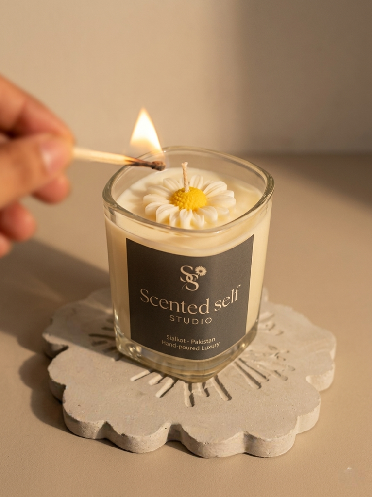 Glass daisy candle